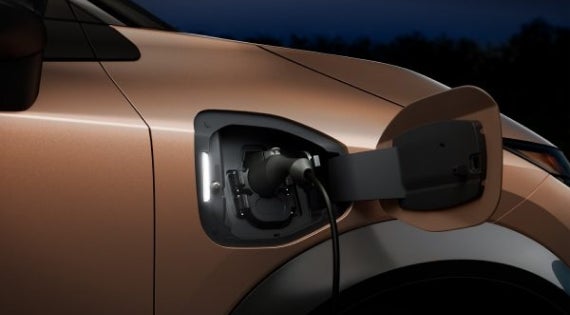 Close-up image of charging cable plugged in | SouthWest Nissan in Weatherford TX
